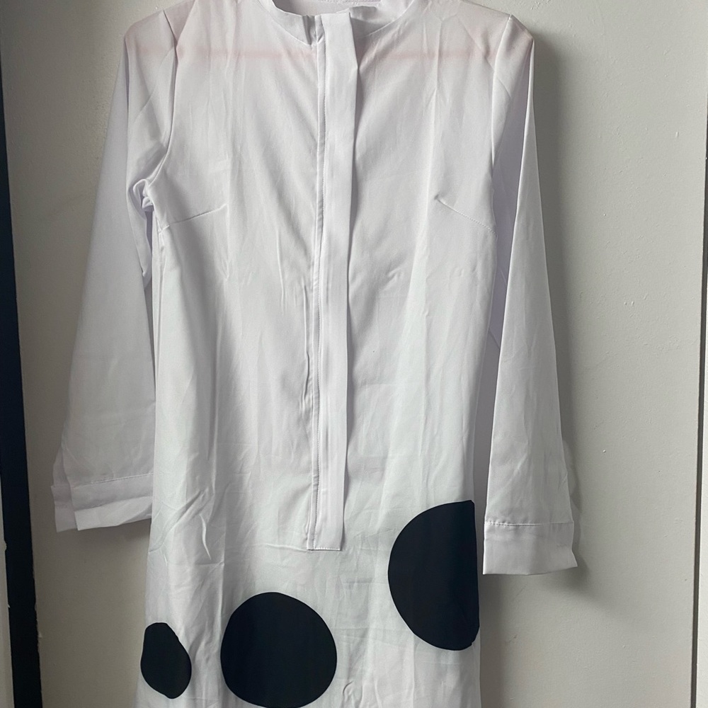 White dress with black polka dots.